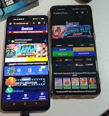 Two smartphones are displayed on a white surface, both showing gambling websites with colorful graphics, text, and various options for logging in and accessing games. The screens are bright and filled with promotional content related to casino and slot games.